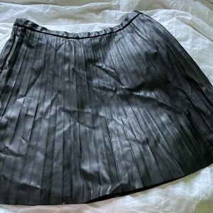 Black pleather mini skirt.